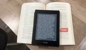 kindle paperwhite on open book