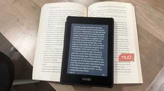 kindle paperwhite on open book