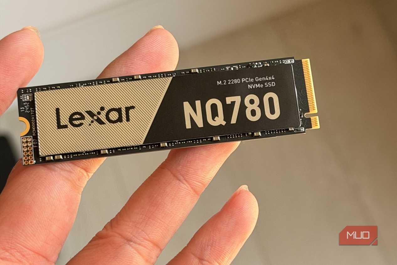 Lexar NQ780 NVMe SSD held between fingers