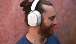 man wearing fiio eh13 headphones turned to the side.