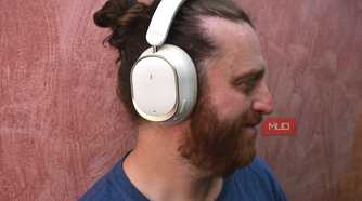 man wearing fiio eh13 headphones turned to the side.