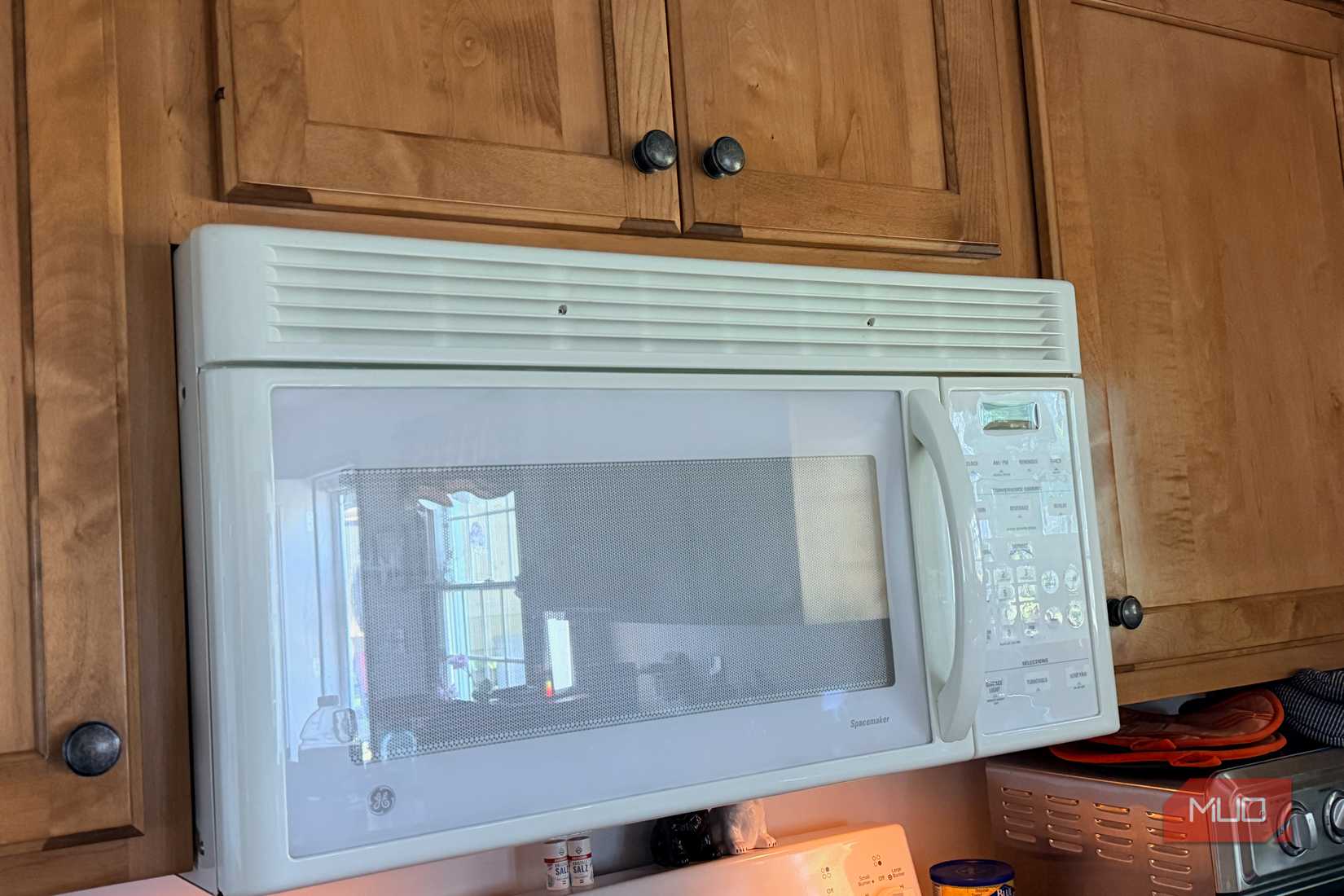 A microwave above a stove.