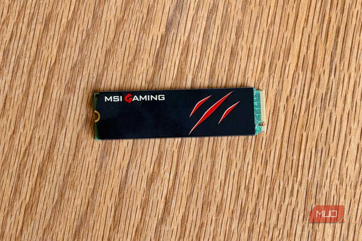 MSI Gaming M.2 NVMe SSD with a claw logo on a wooden desk