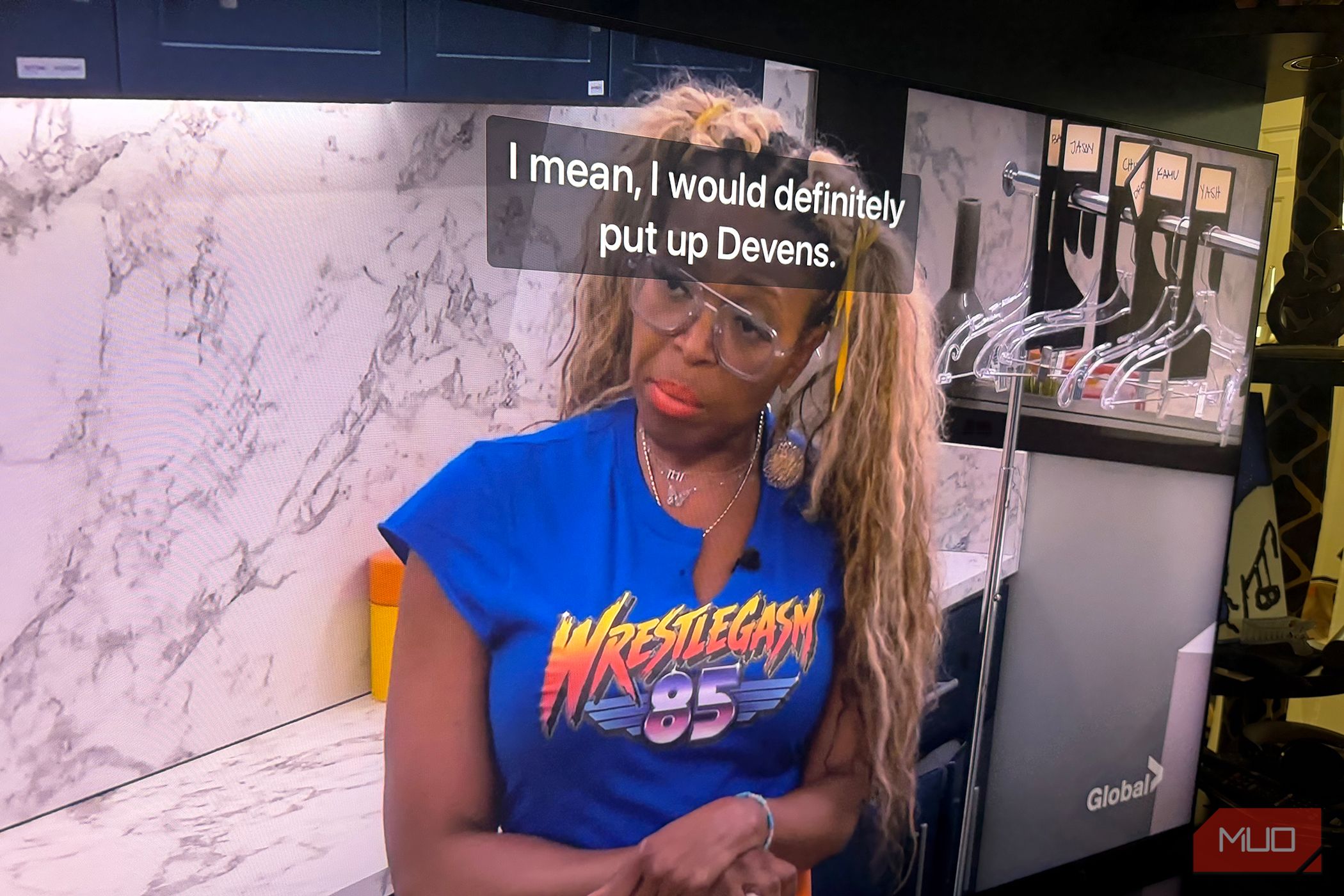A woman talking on Big Brother with captions in front of her face.