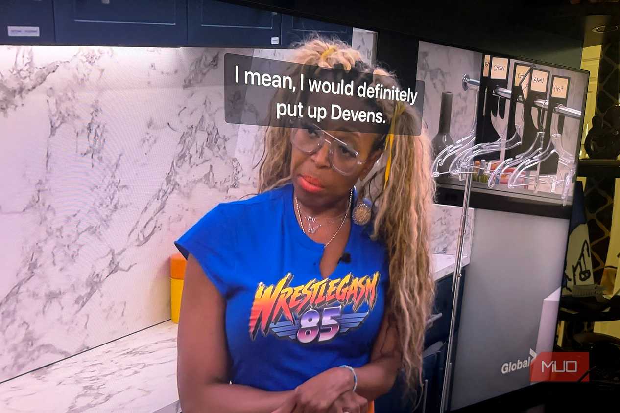 A woman talking on Big Brother with captions in front of her face.