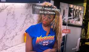 A woman talking on Big Brother with captions in front of her face.