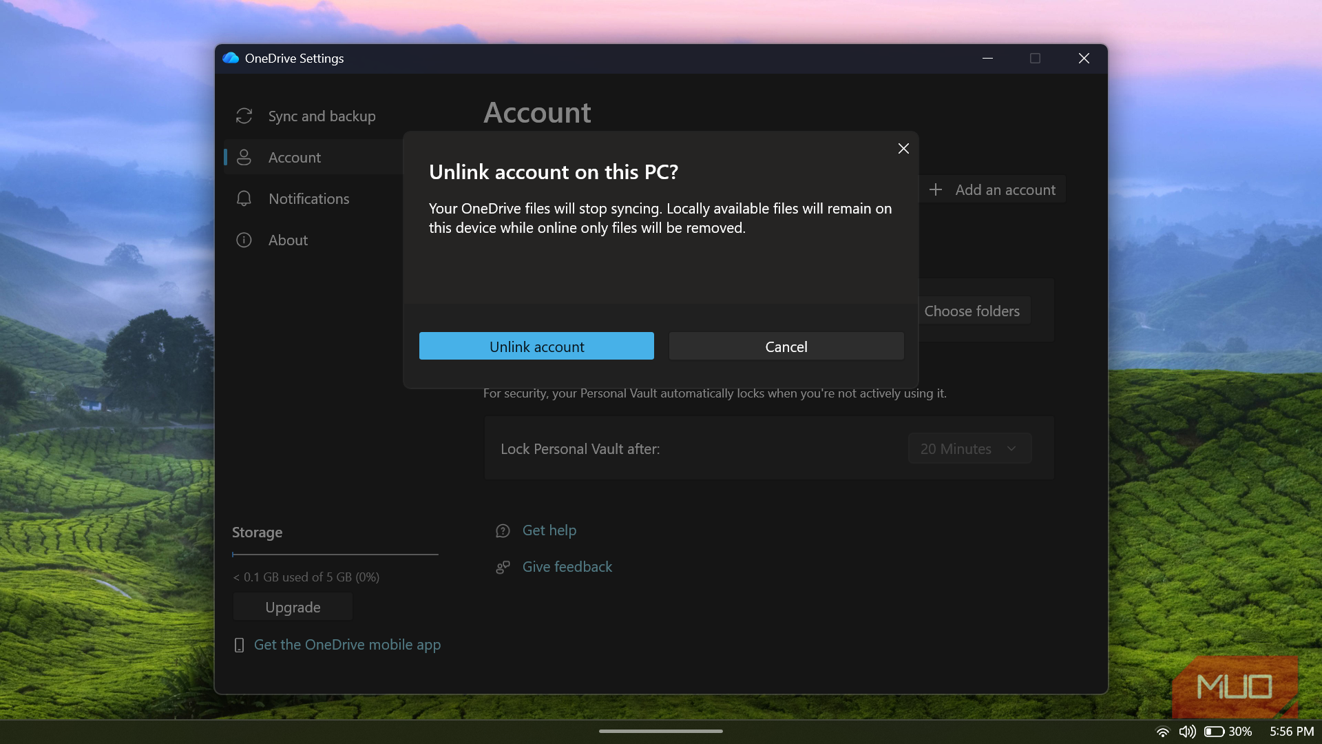 OneDrive settings showing unlink account confirmation dialog