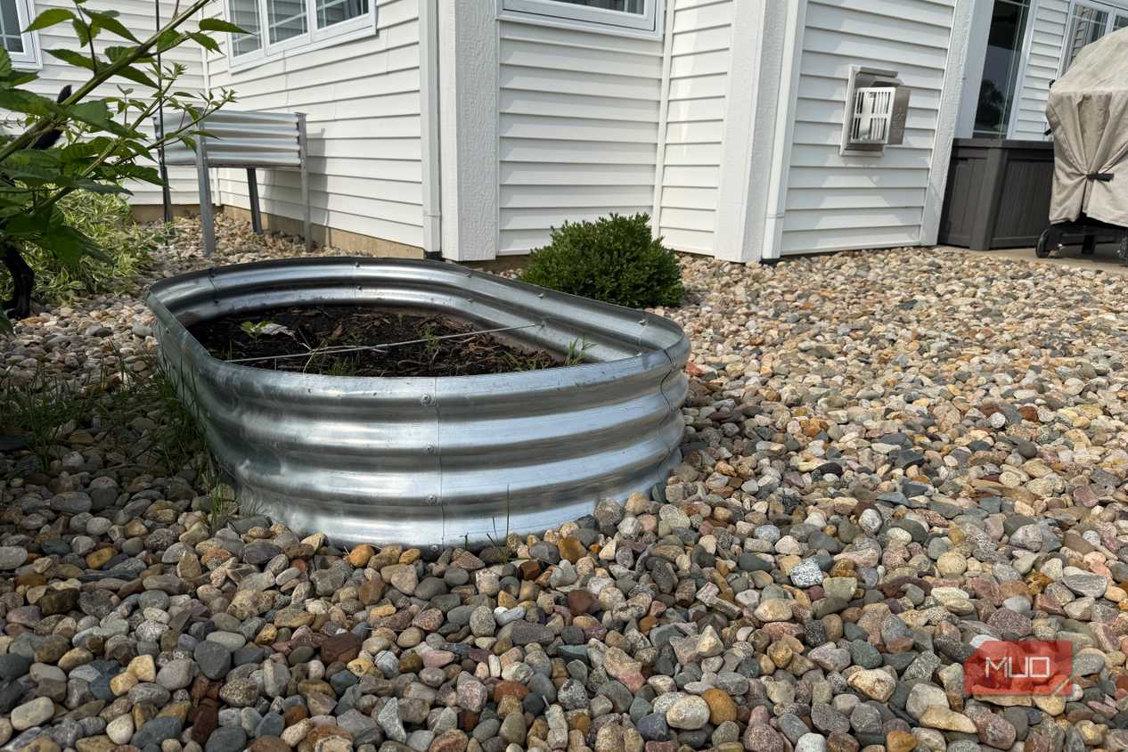 Oval Galvanized Raised Garden Bed Beside White House-1
