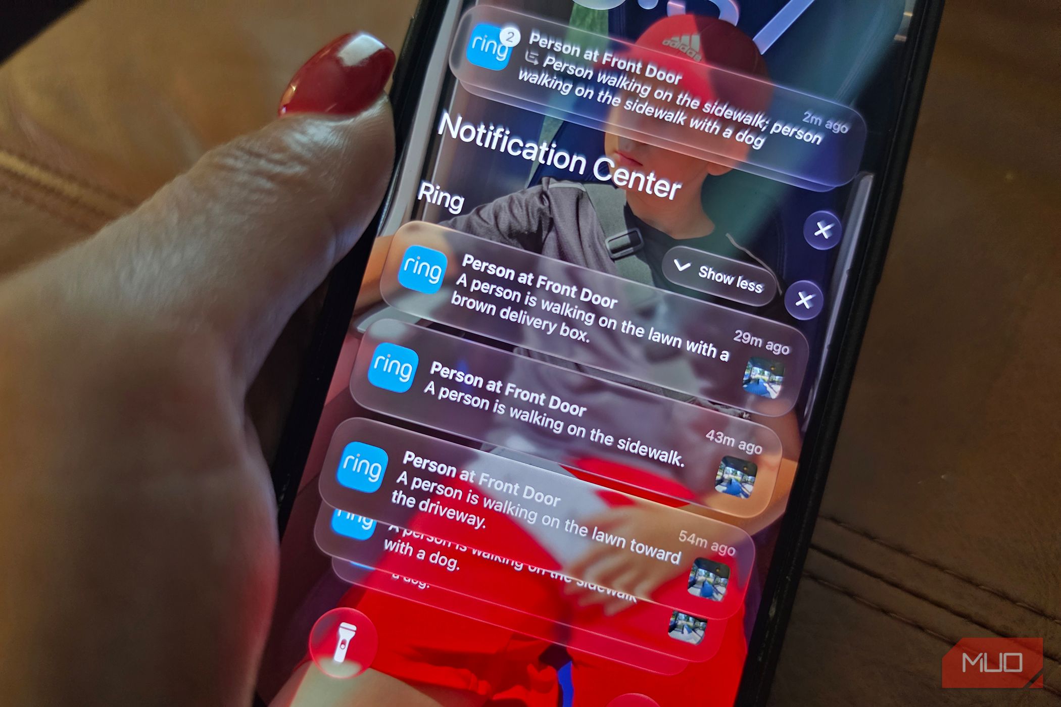 An iPhone showing Ring notifications on the lock screen.