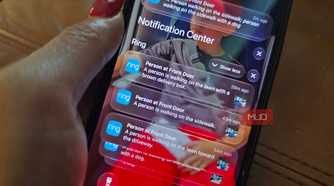 An iPhone showing Ring notifications on the lock screen.