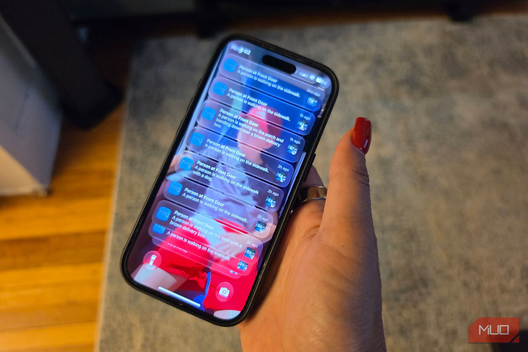 An iPhone showing Ring notifications on the lock screen.