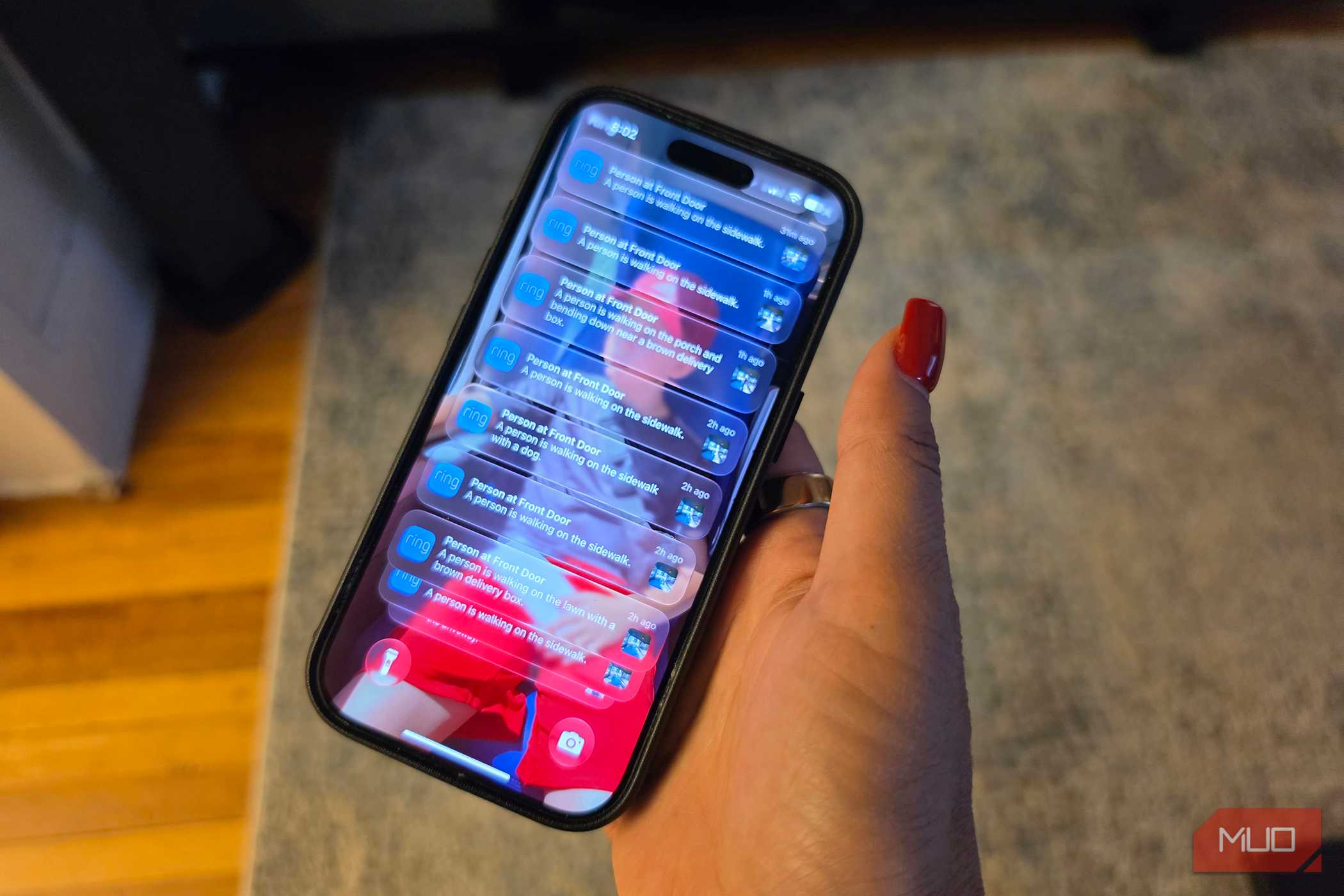 An iPhone showing Ring notifications on the lock screen.