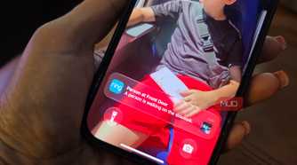 An iPhone showing Ring notification on the lock screen.