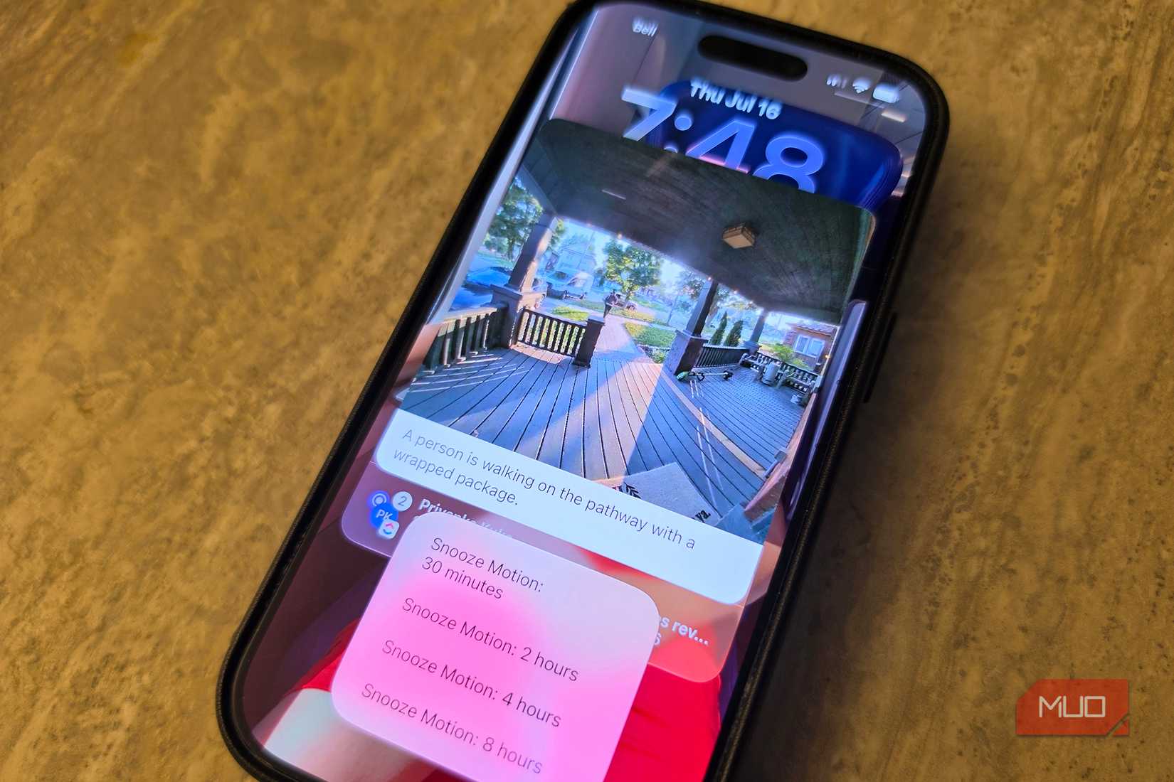 The preview screen of the iPhone's Ring app shows a man unloading his luggage.