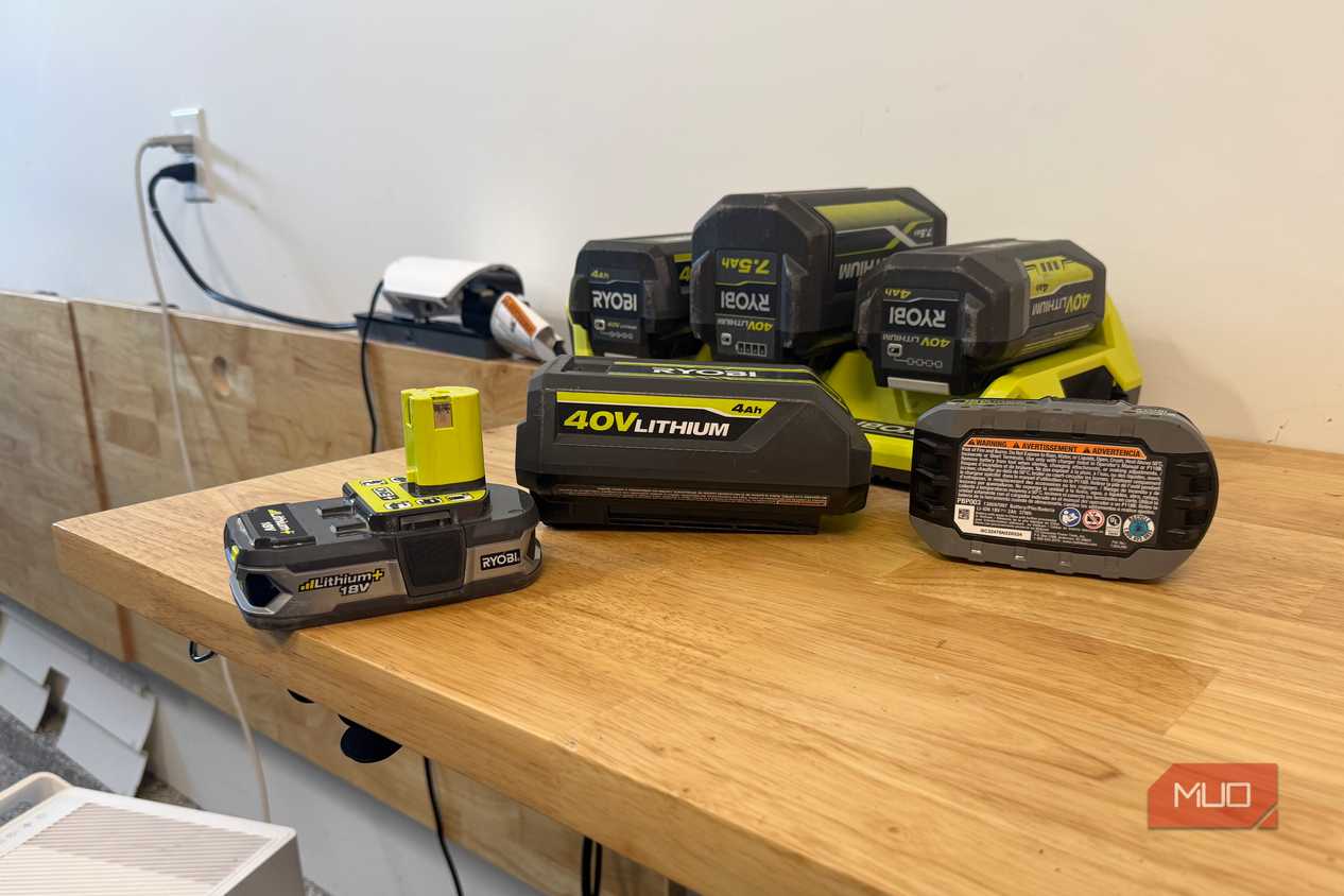Various Ryobi 18V and 40V batteries on a table