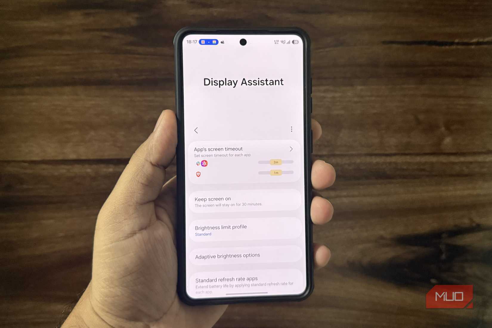 Samsung phone in hand showing display module