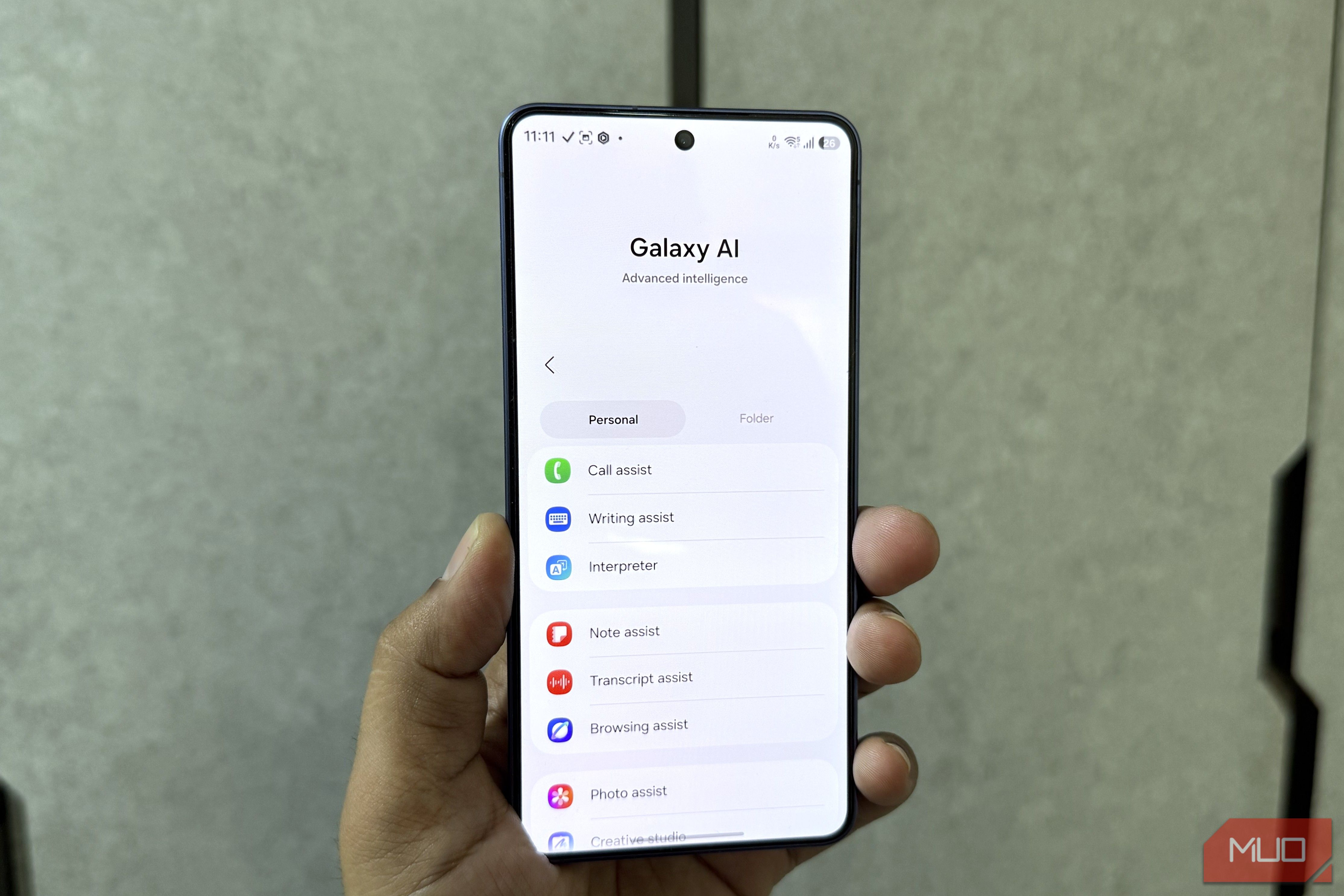 Samsung phone in hand showing Galaxy AI menu