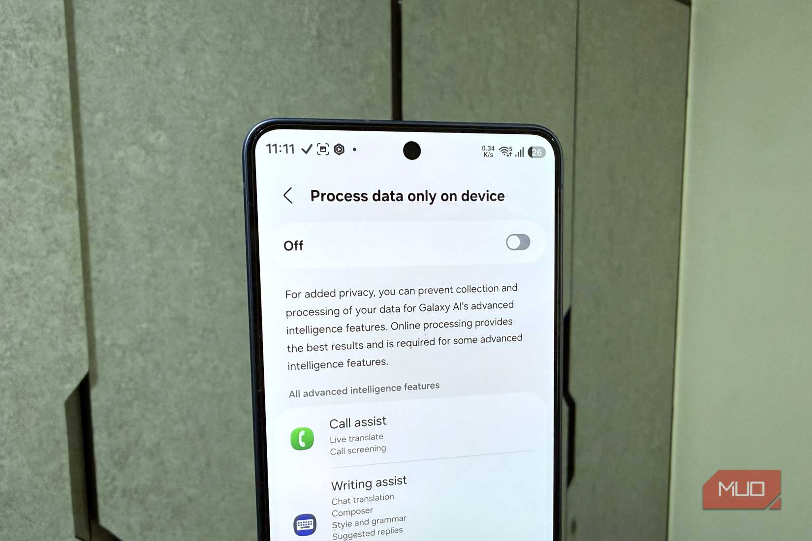 Samsung phone in hand showing Galaxy AI on device processing menu
