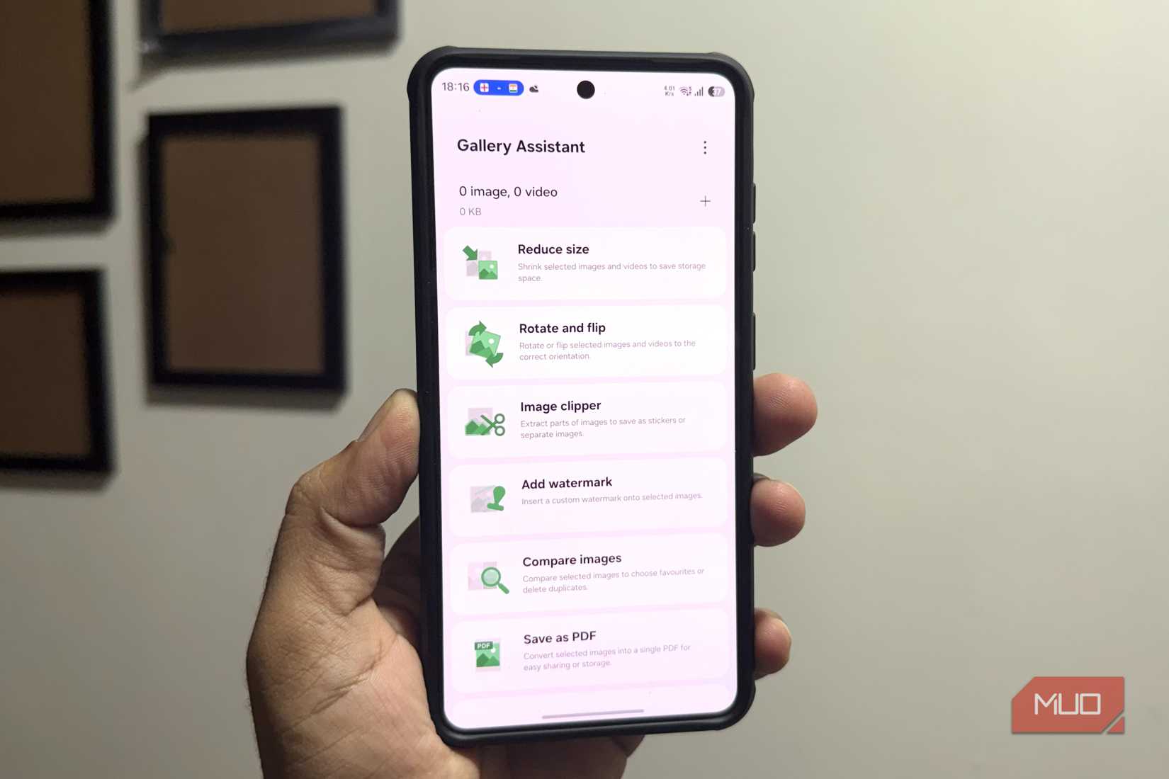 Samsung phone in hand showing Gallery Assistant module