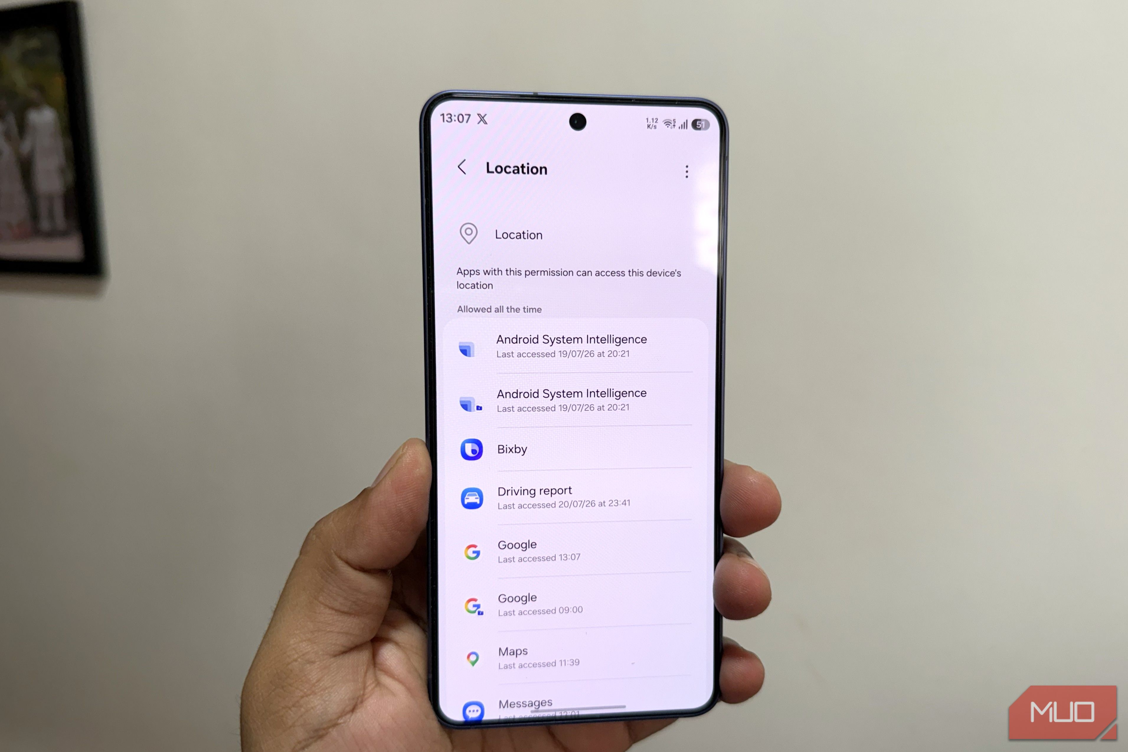 Samsung phone in hand showing location menu