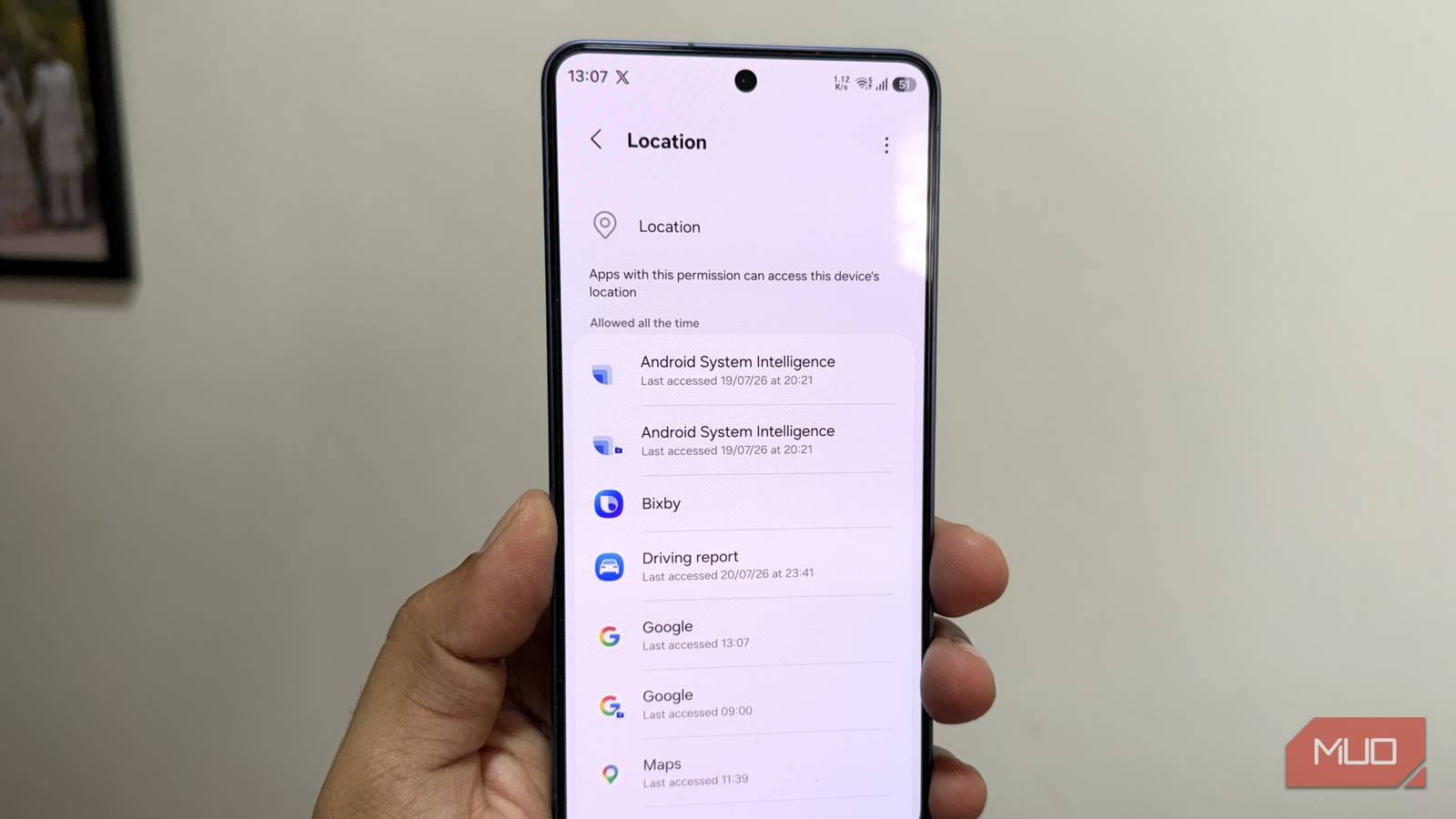 Samsung phone in hand showing location menu