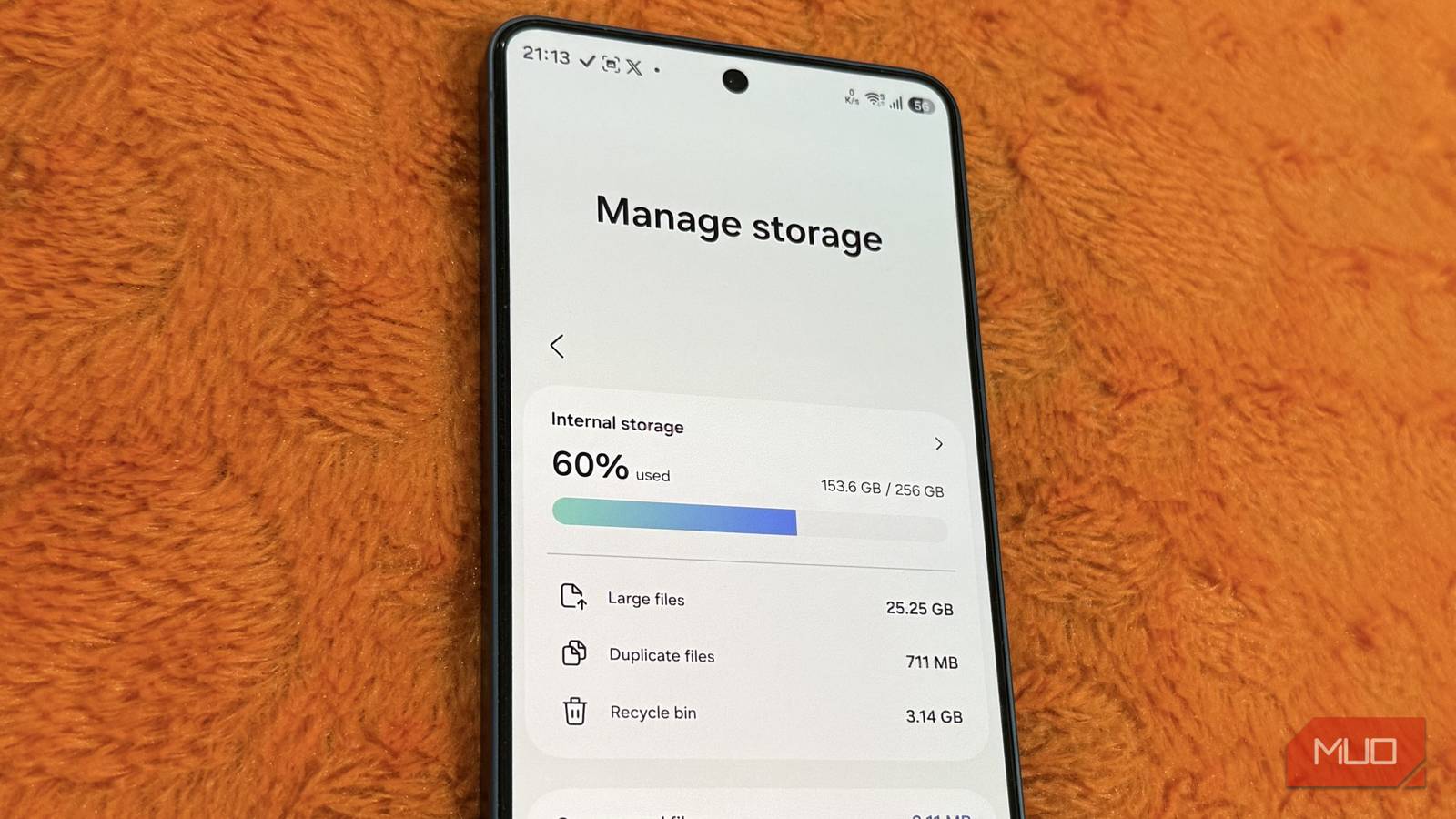 Samsung phone on a pillow showing storage menu