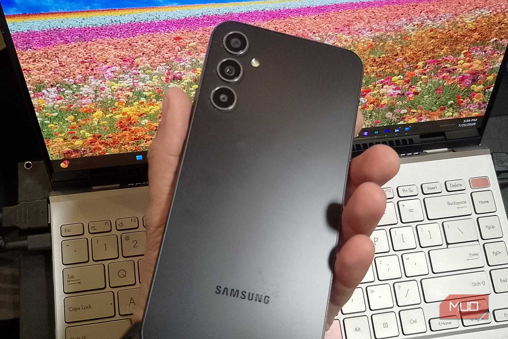 A hand holding a Samsung phone