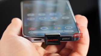 A SanDisk USB-C drive plugged into a Pixel 10 Pro.