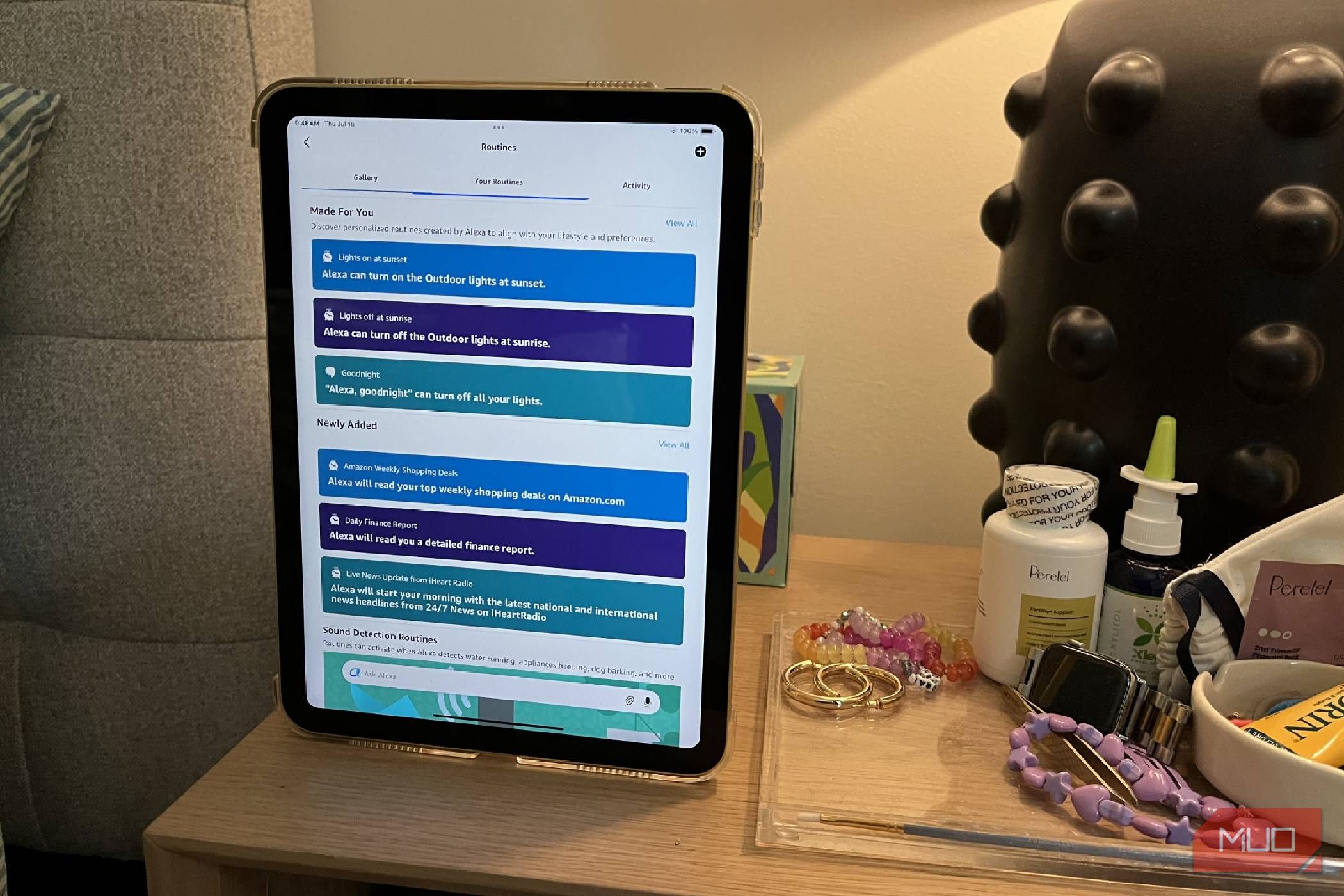 A tablet on a nightstand showing the routines in Alexa app.