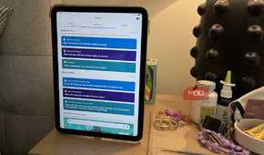 A tablet on a nightstand showing the routines in Alexa app.