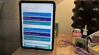 A tablet on a nightstand showing the routines in Alexa app.