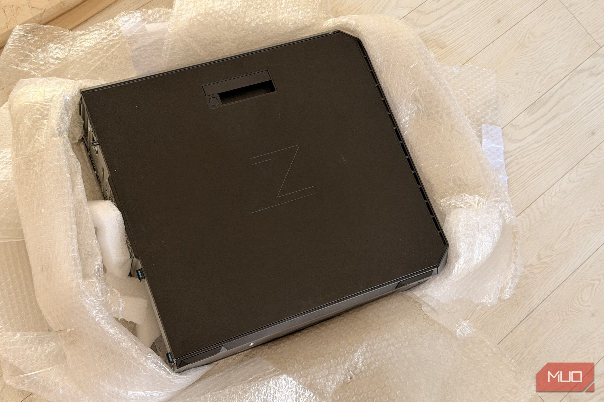 Top of the HP Z6 G4 workstation case wrapped in plastic and foam padding