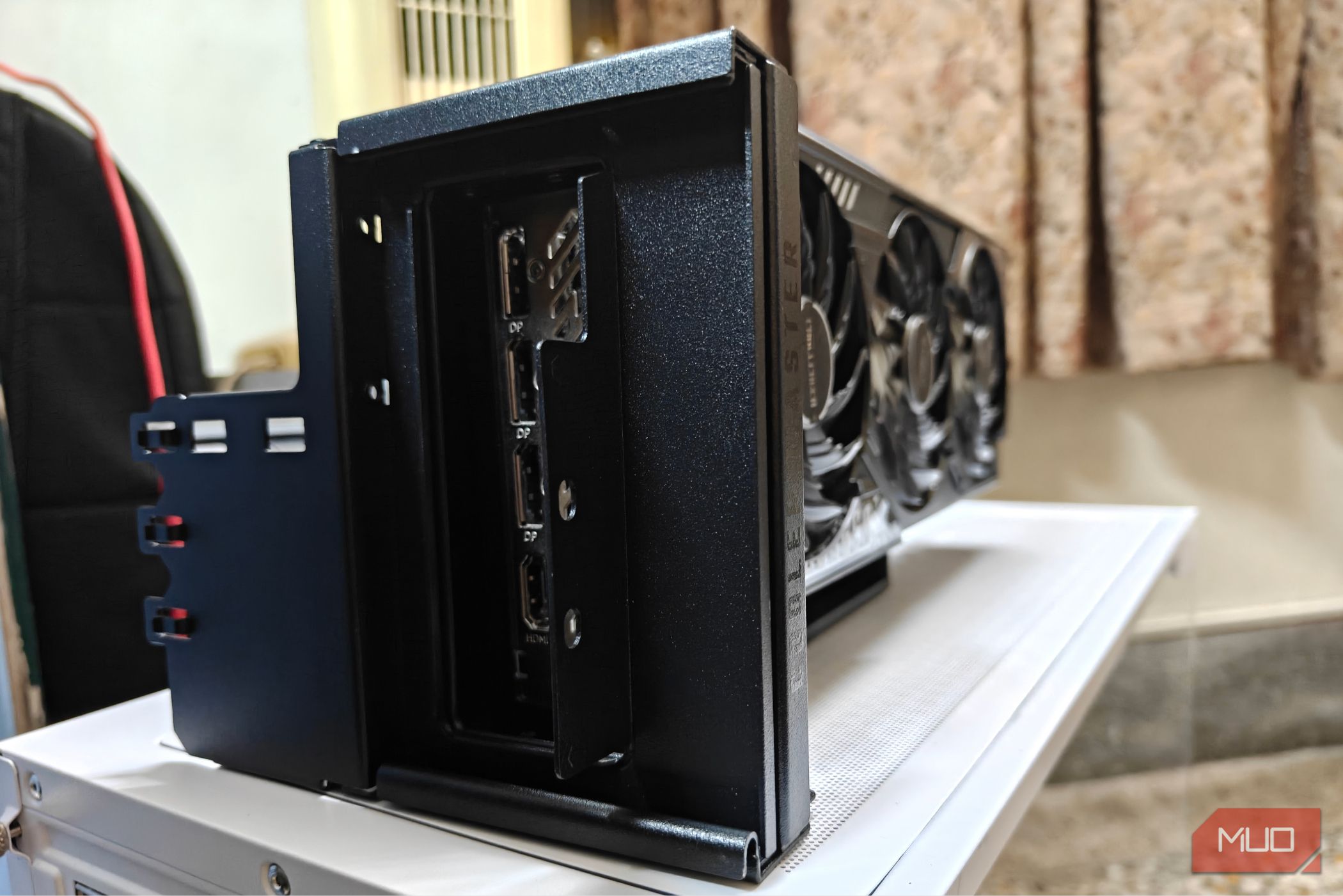 An RX 9070 with the vertical GPU mount fully assembled