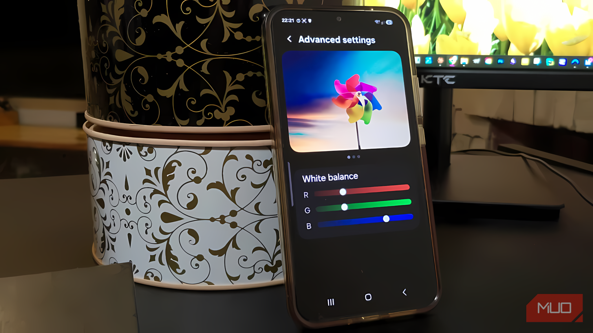 A Samsung Galaxy A34 phone showing Advanced settings on the display