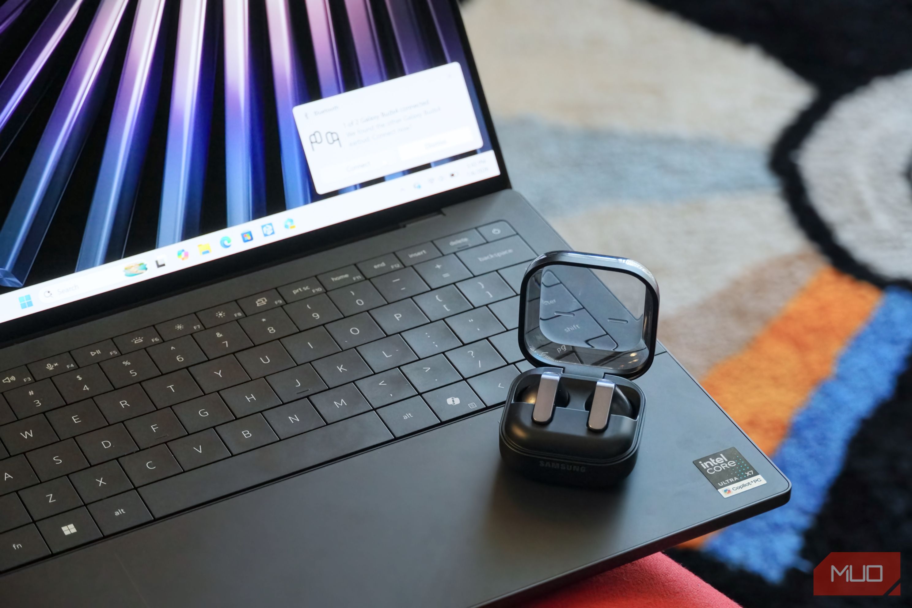 A Windows laptop with a pair of Galaxy Buds 4 using the Audio Sharing feature. 
