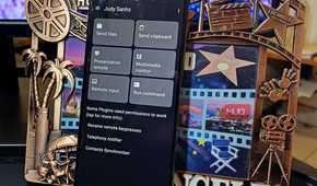 An Android phone with Zorin Connect on its display leaning on a frame