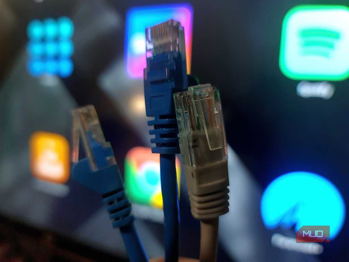 Three ethernet cables, 2 cat5e, 1 cat6a selected for speed testing