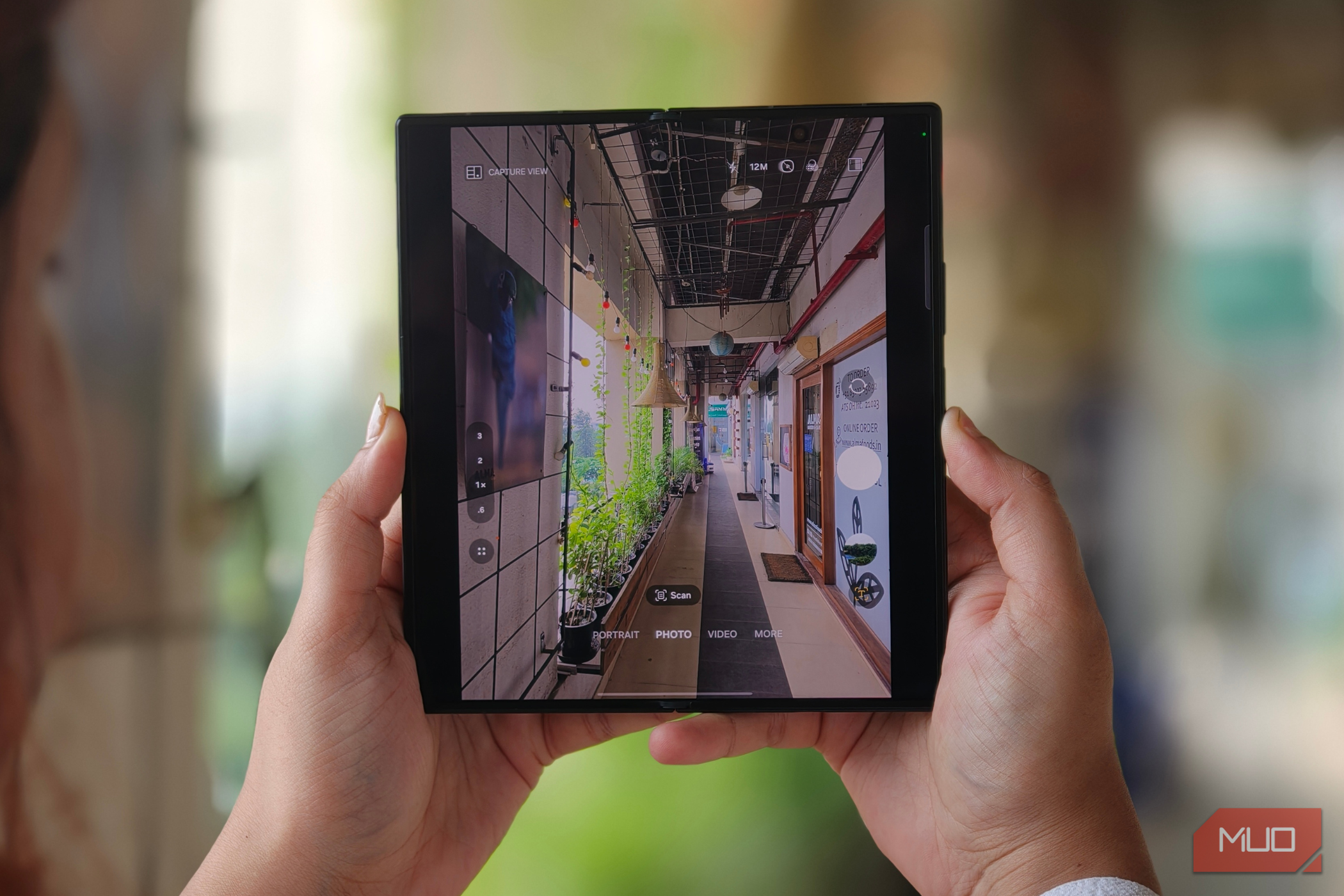 A person clicking a picture with the Samsung Galaxy Z Fold 8 Ultra