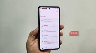Android phone in hand showing Breezy Weather app
