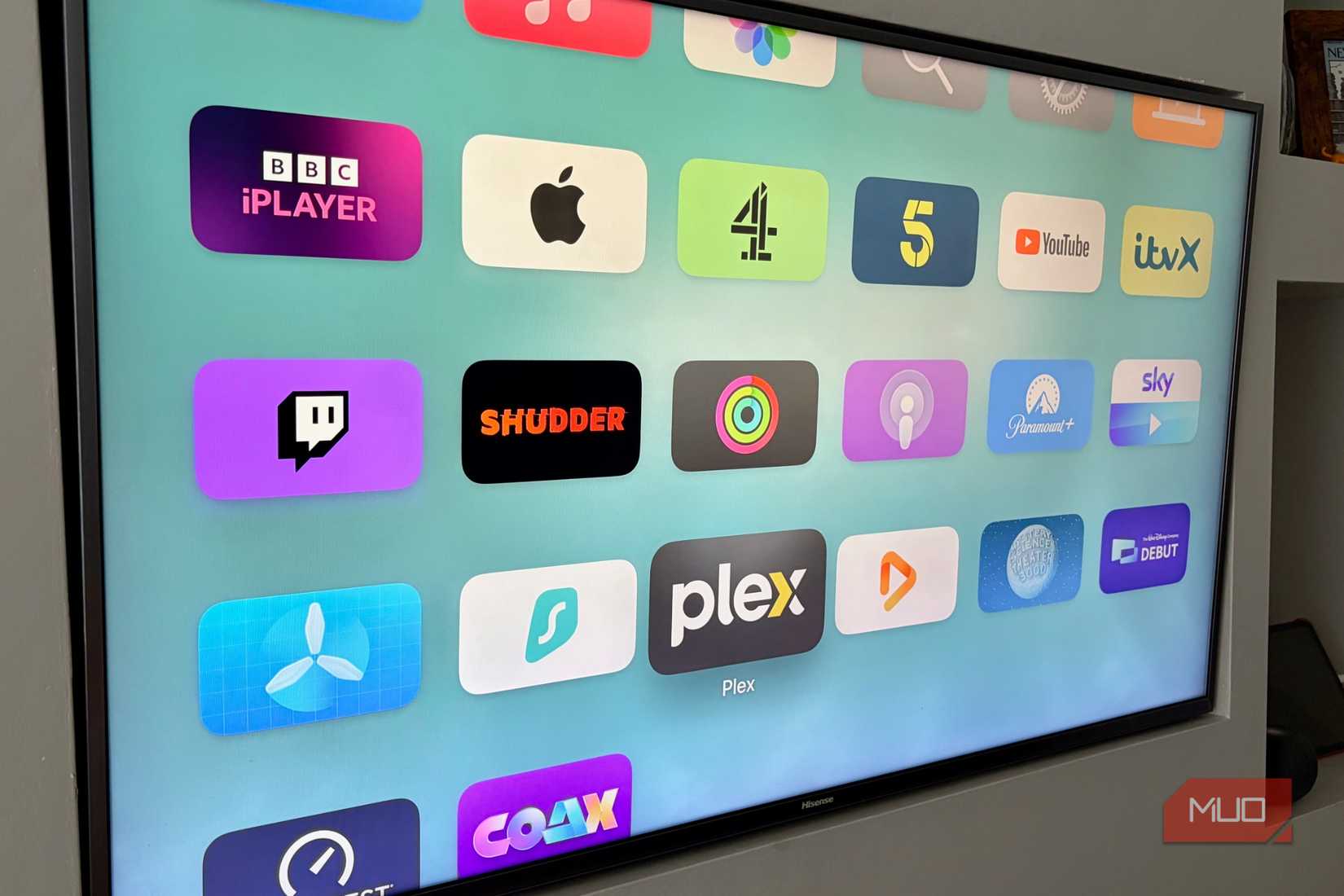 The Apple TV Home Screen showing the Plex app highlighted alongside the Infuse app