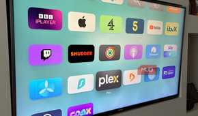 The Apple TV Home Screen showing the Plex app highlighted alongside the Infuse app