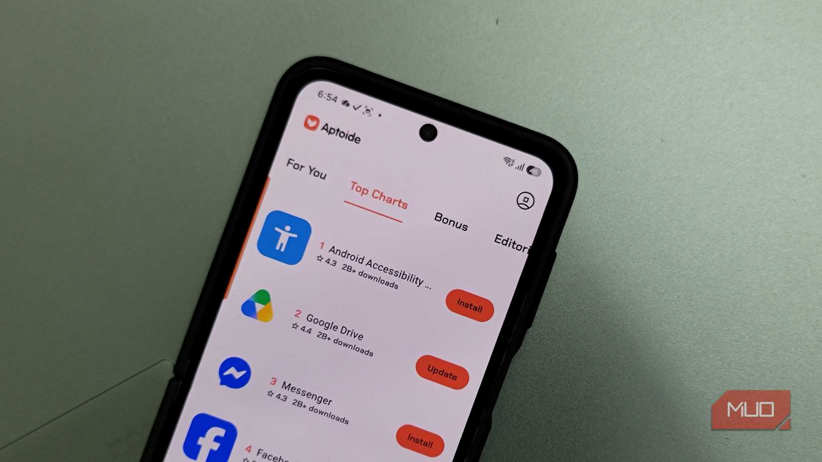 aptoide app top charts showing android accessibility google drive messenger