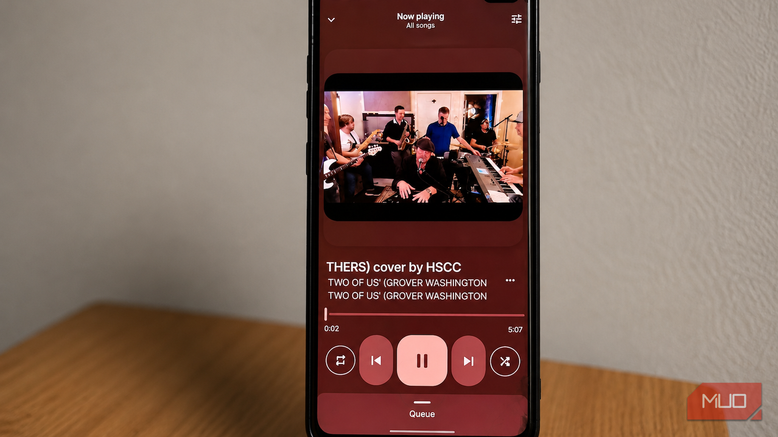 Auxio music player with a track playing.
