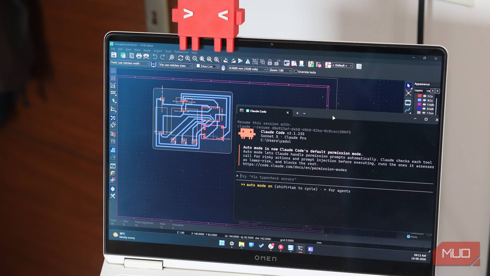 Claude Code running KiCAD on Windows 11 laptop.