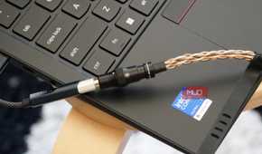 A Fiio KA11 USB-C DAC plugged into a Lenovo laptop.