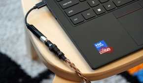 A Fiio KA11 USB-C DAC plugged into a Lenovo laptop.