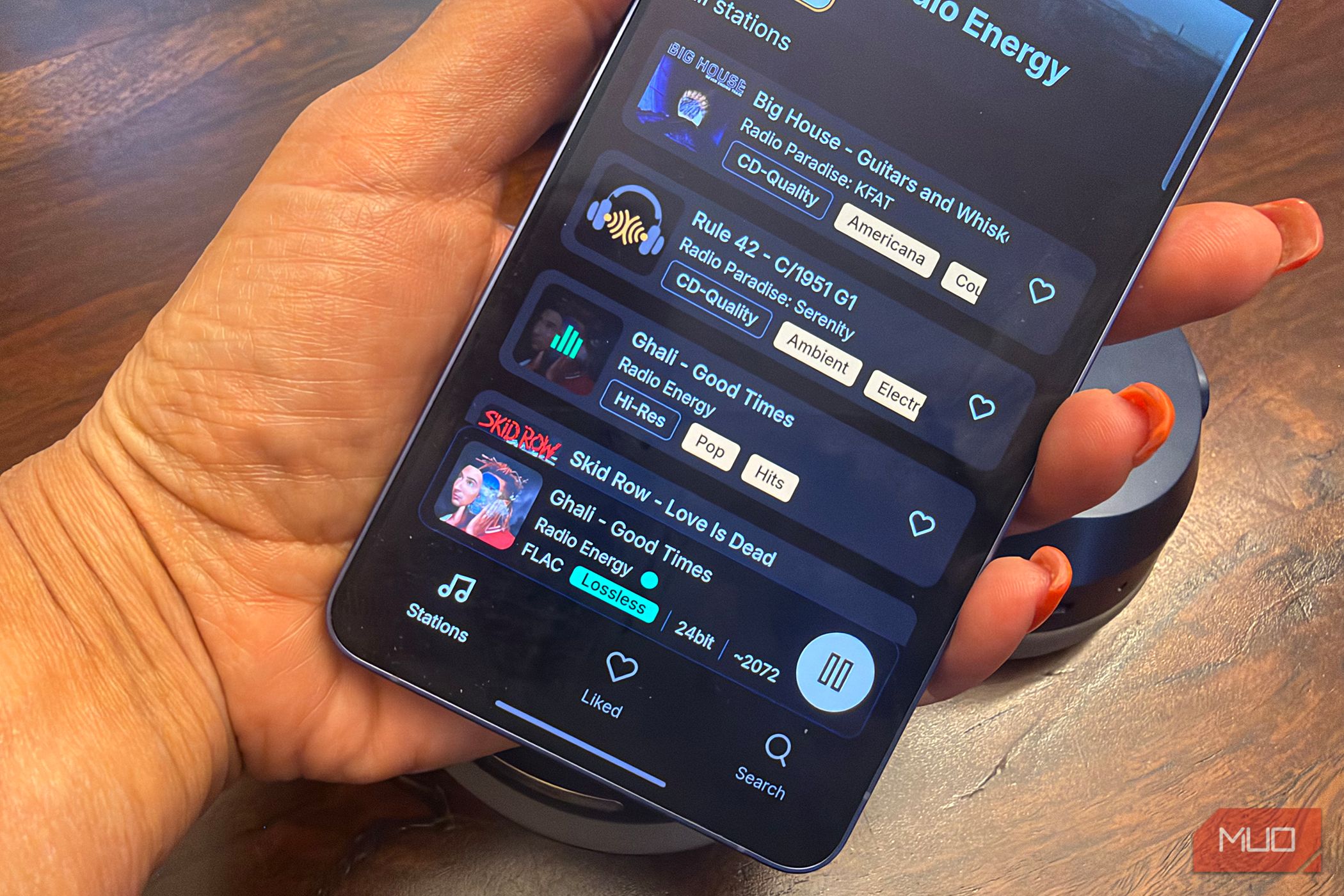 An audio file being played in FLAC Lossless quality on a Samsung Galaxy S26 Ultra in hand.