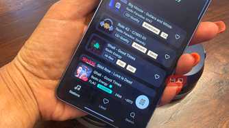 An audio file being played in FLAC Lossless quality on a Samsung Galaxy S26 Ultra in hand.