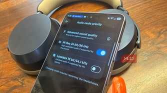 A Samsung Galaxy S26 Ultra showing Hi-Res audio with the Sennheiser Momentum 5 Wireless headphones in the background.