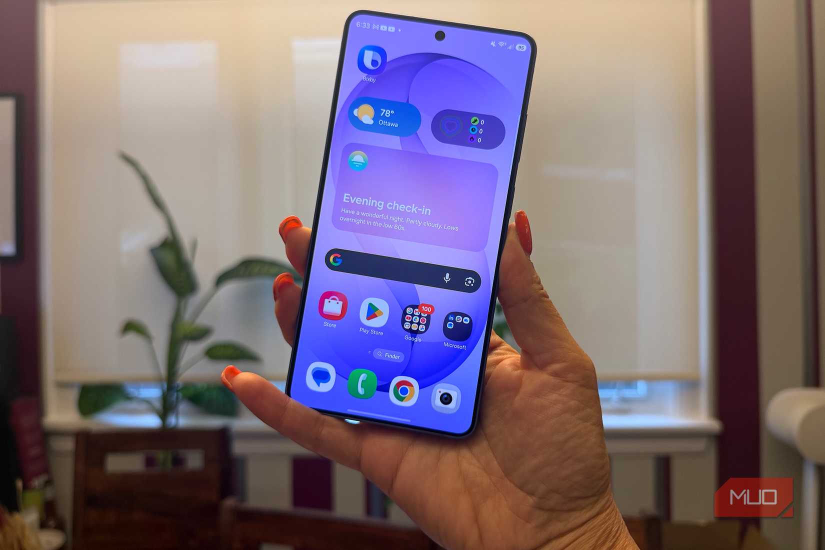 A Samsung Galaxy S26 Ultra in hand.
